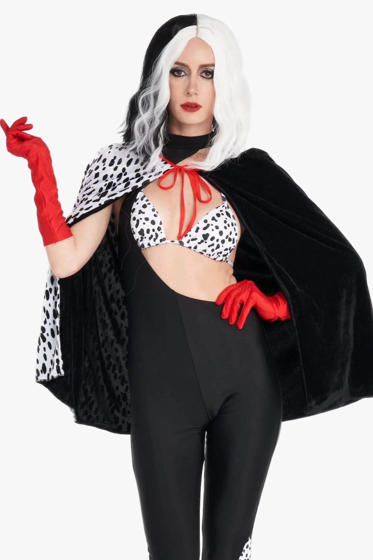 Model in black and white dalmatian villain-inspired cruella costume with faux fur and dramatic contrast