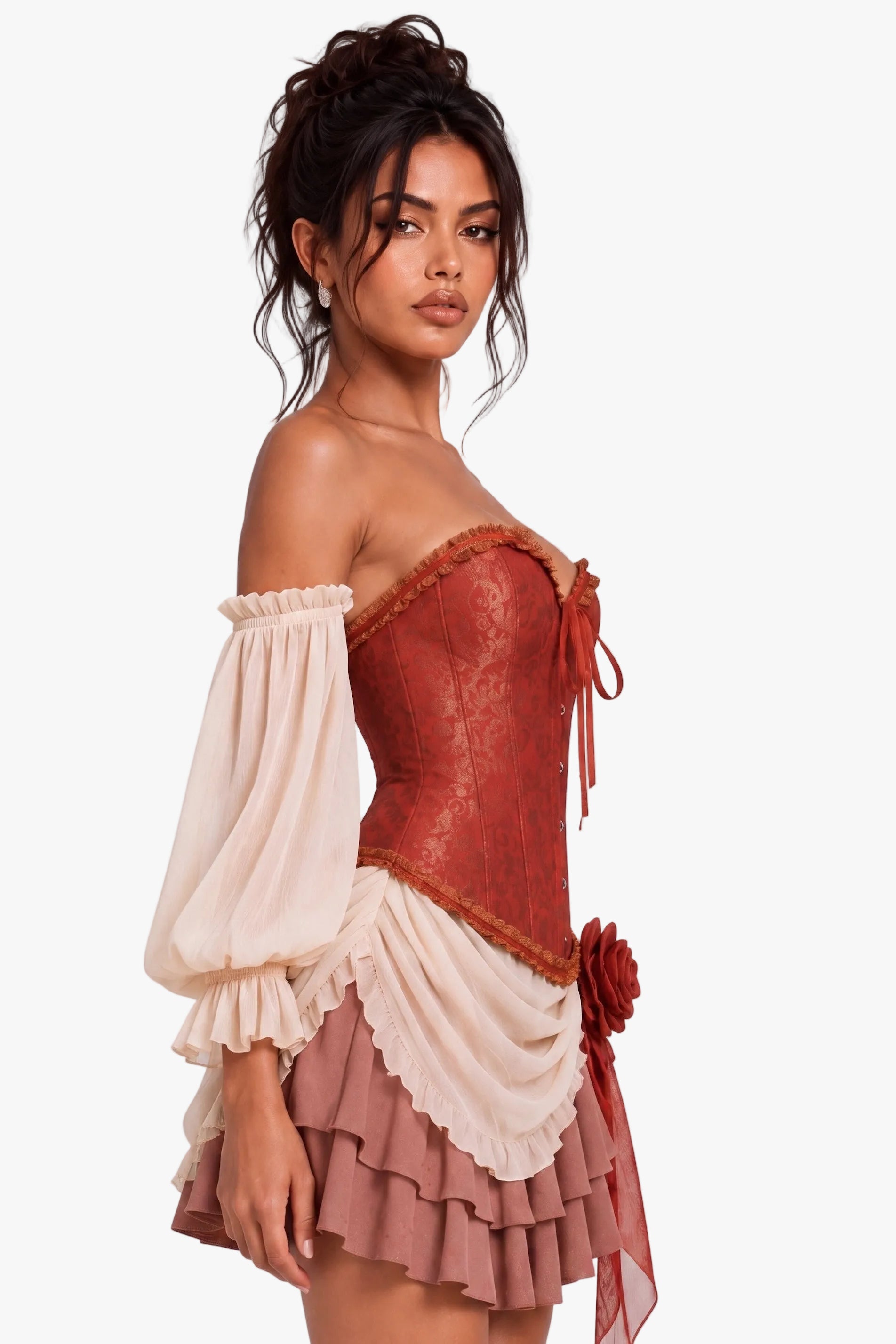 A woman modeling a short off-the-shoulder costume dress with a rust-red lace corset top, cream puff sleeves, a cream ruffled overlay, and a dusty rose ruffled skirt with a red flower detail, set against a plain light gray studio background.