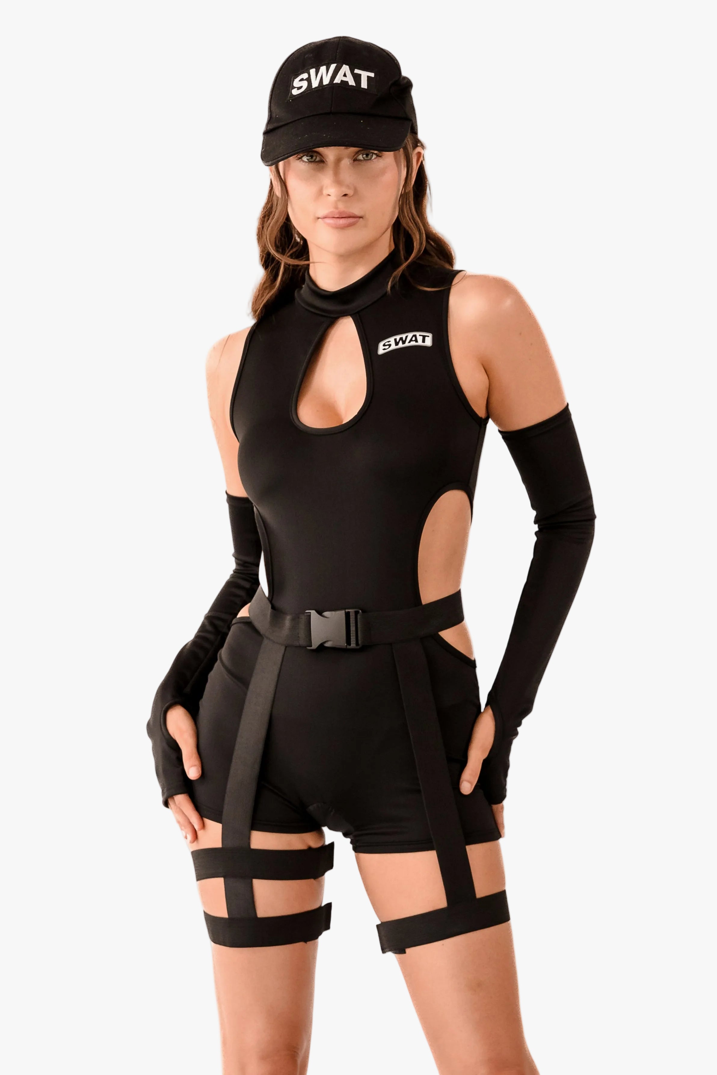 A model wearing a black SWAT-themed bodysuit with cutouts, matching black shorts, fingerless gloves, arm warmers, and a black cap with 'SWAT' printed in white, set against a plain light gray background.
