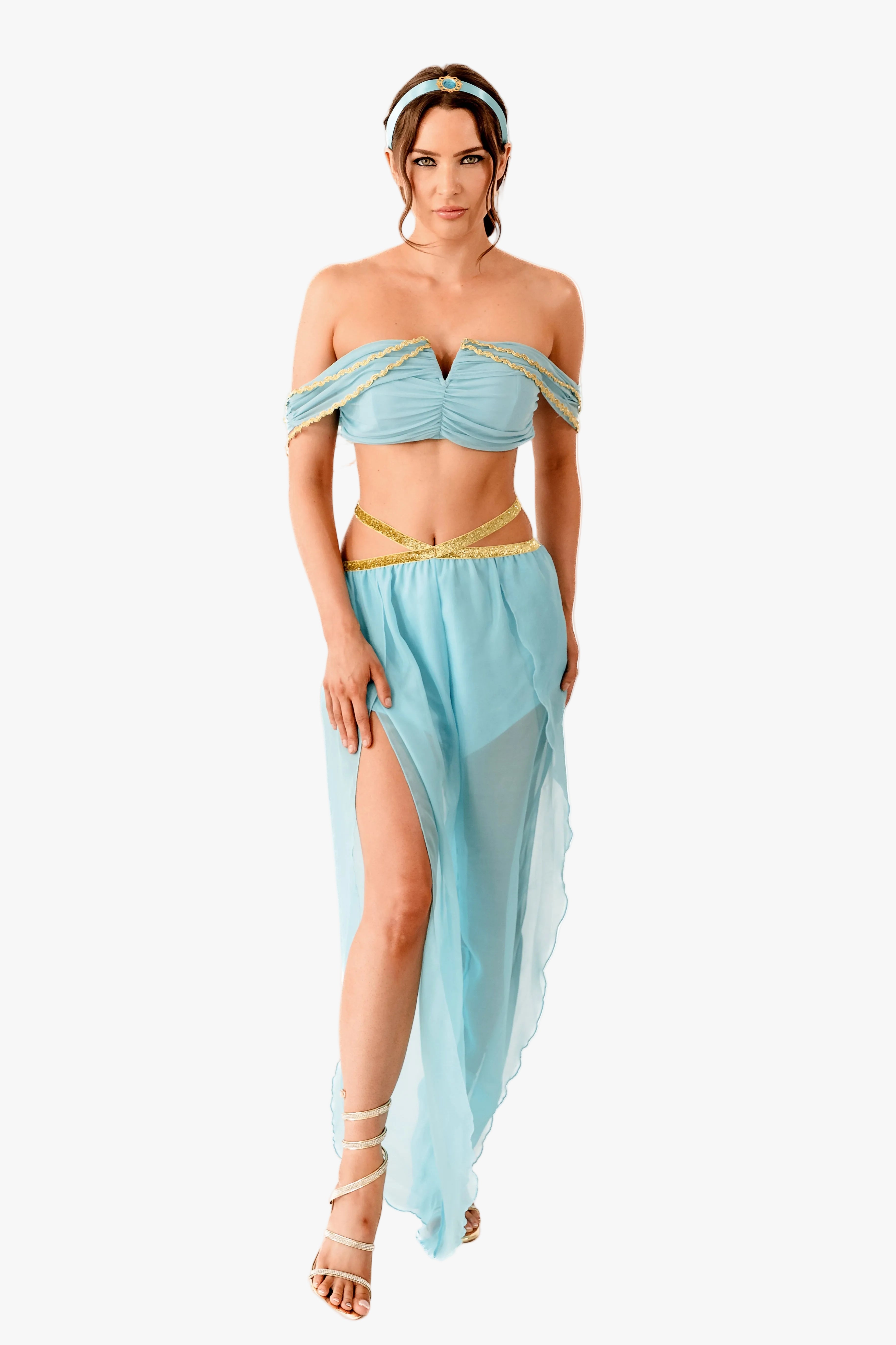 A woman modeling jasmine two-piece outfit with an off-the-shoulder bandeau top and a matching sheer draped skirt, accented with gold trim, against a plain white background.