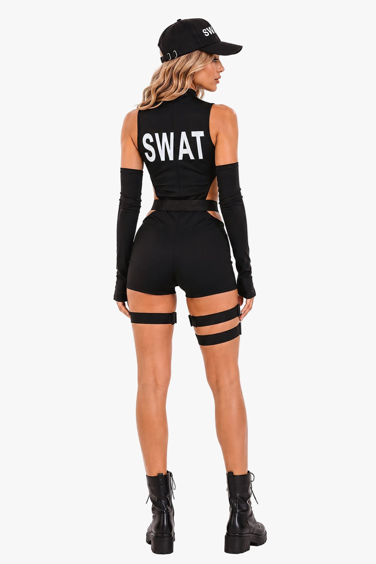 A woman shown from the back wearing a black tactical-style one-piece outfit with long sleeves, shorts, thigh straps, and large white 'SWAT' lettering on the back. She is also wearing a black cap and black ankle boots against a plain light gray studio background.