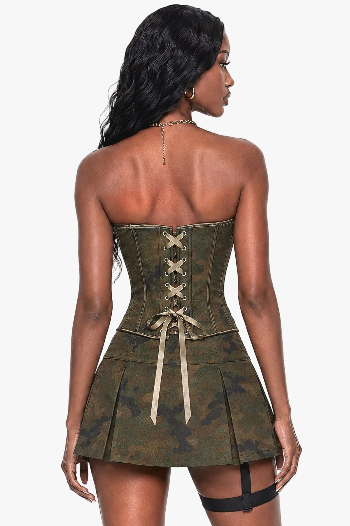 A woman shown from the back wearing a strapless camouflage mini dress with a corset-style back, beige lace-up detailing, and a pleated skirt, against a plain light background.