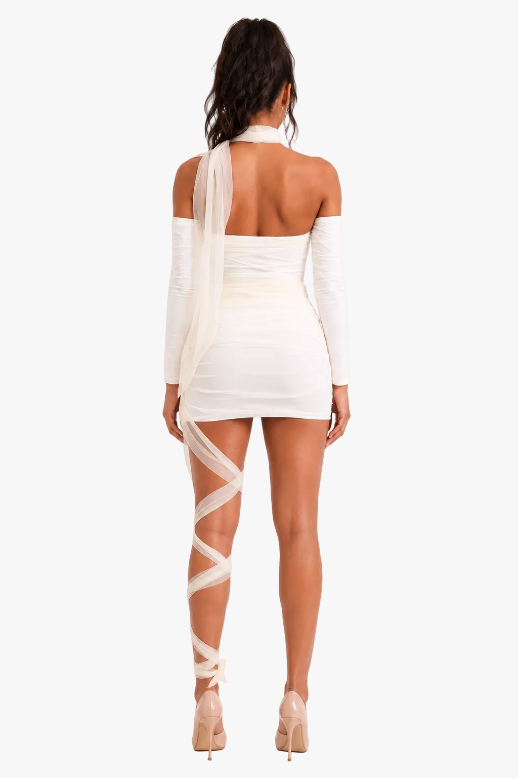 A woman shown from the back wearing a fitted off-white mini dress mummy costume with long sleeves, a halter-style neckline, and sheer wraparound straps that extend down the legs, paired with nude high heels against a plain light background.