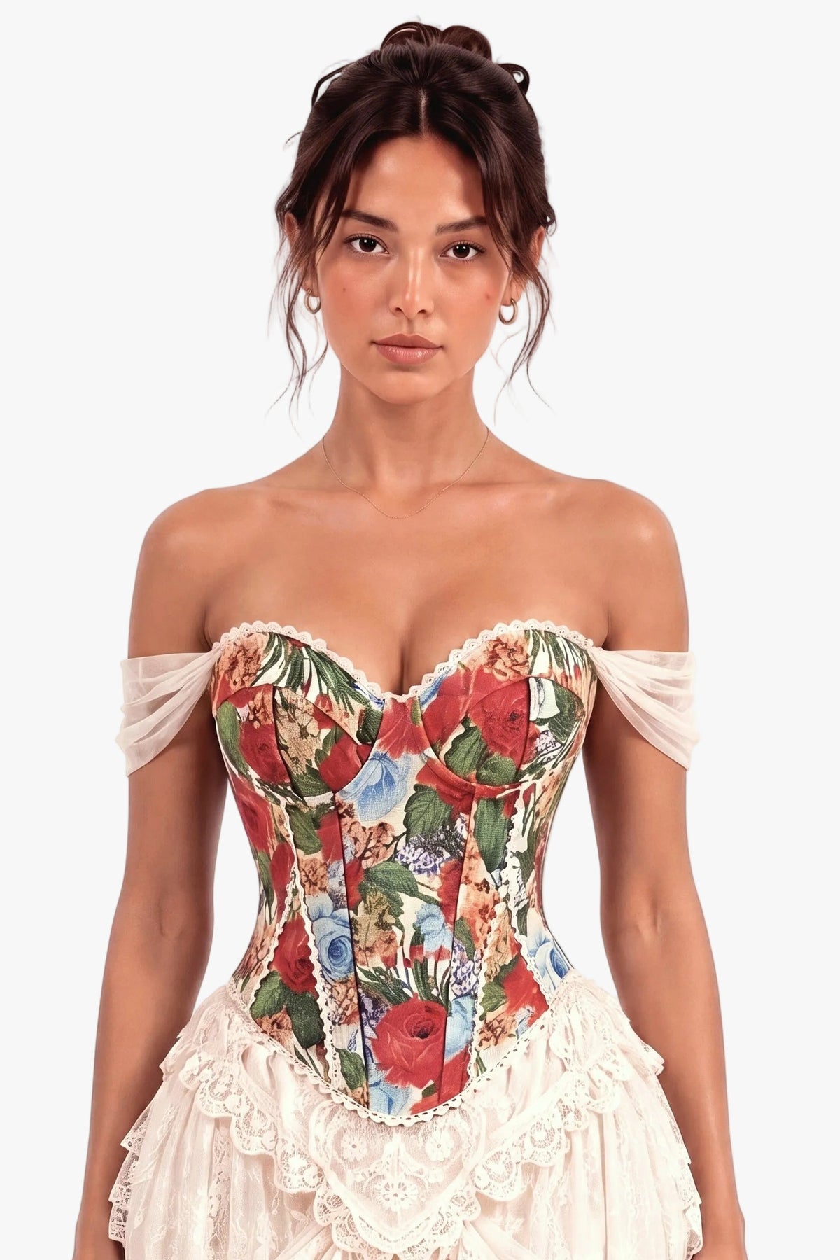A woman modeling an off-the-shoulder corset dress with a colorful floral-patterned corset bodice and a cream ruffled skirt, set against a plain light background.