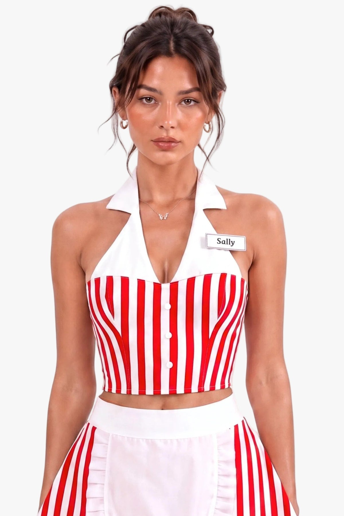 A woman modeling a red and white vertically striped diner costume set consisting of a halter crop corset top, matching skirt, and a white apron with a ruffled hem. She is wearing a name tag that says 'Sally' against a plain white background.