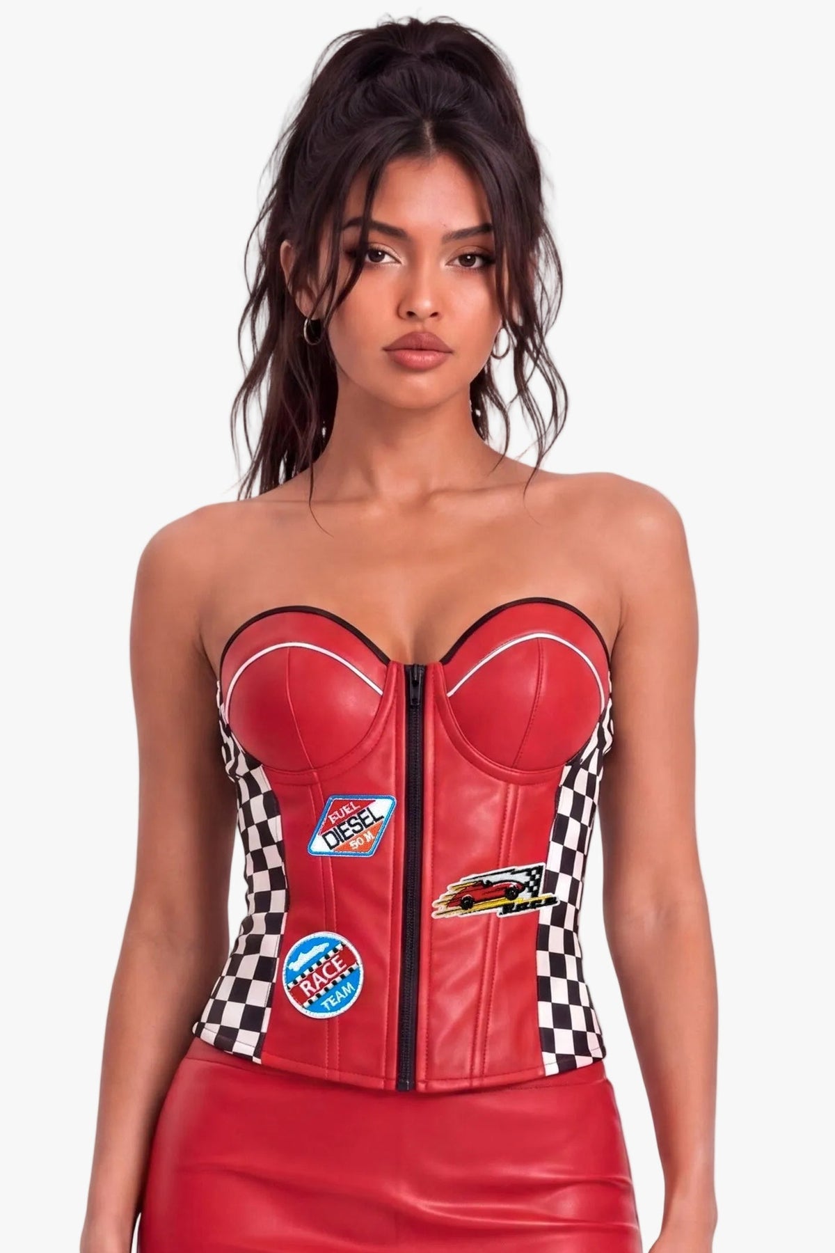 A model wearing a red faux leather racing-themed sweetheart corset-style top, black and white checkered side panels, and racing patch details, set against a plain white studio background.